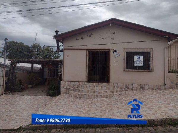 Casa com prédio comercial